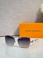 Sunglasses with dark gray square frames and gold-tone metal temples