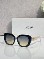 Celine wide cat-eye sunglasses, black frames with gradient tinted lenses