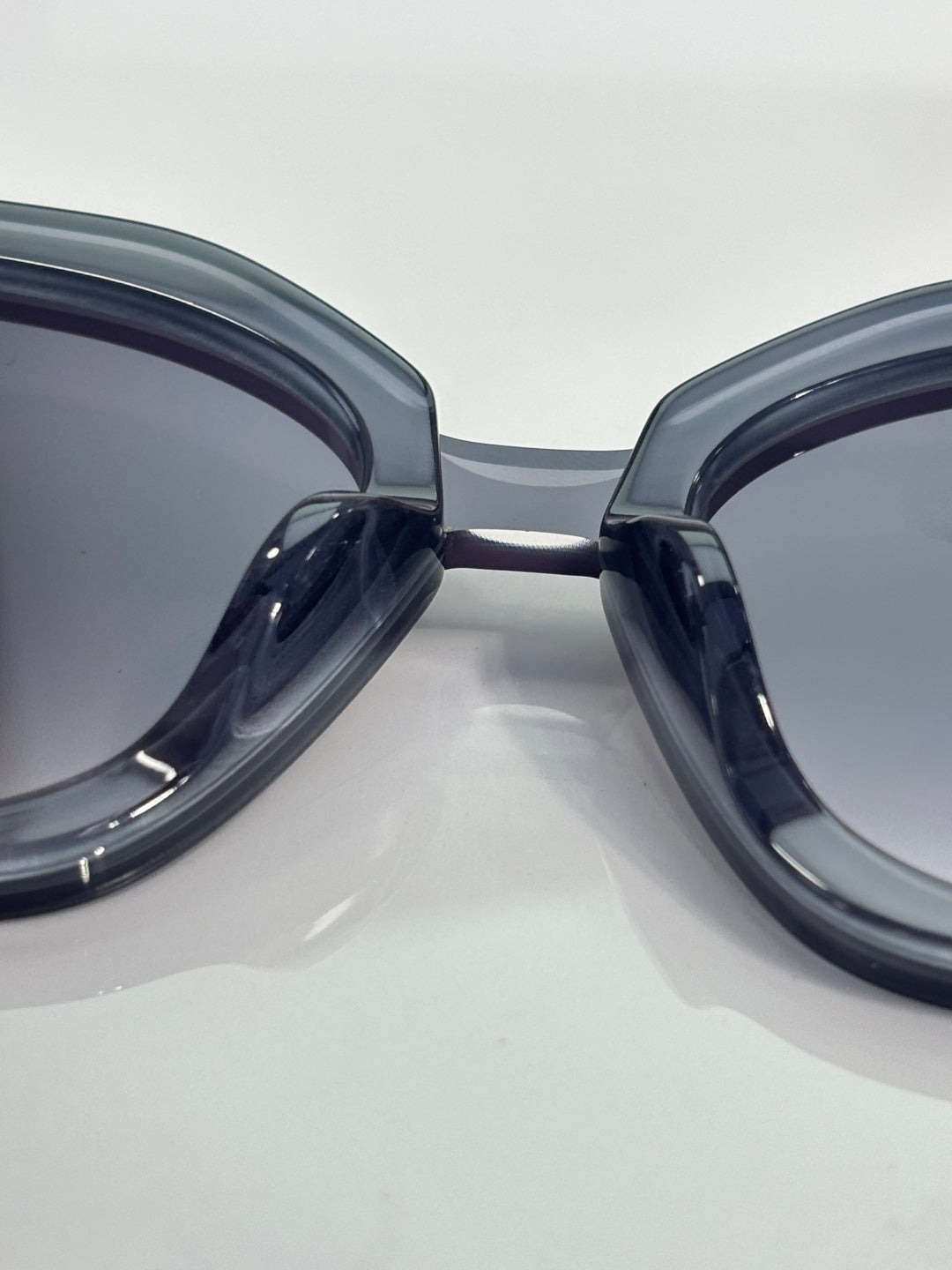 Sunglasses front close-up, dark blue frames with tinted lenses
