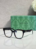 Rectangular eyeglasses with dark navy glossy frame and clear lenses