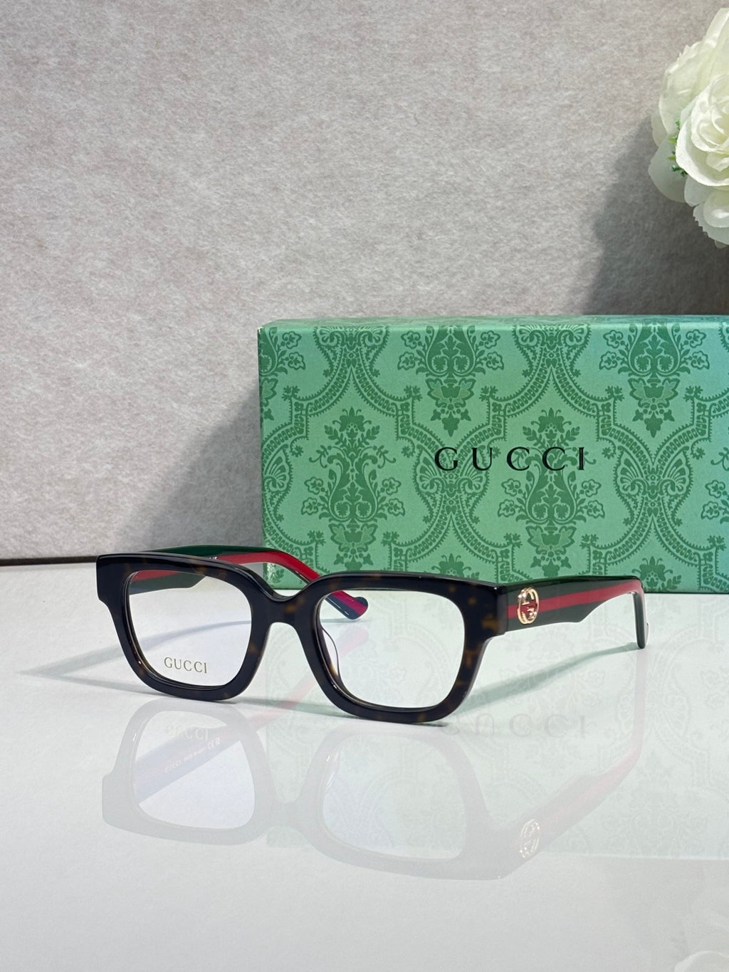 Gucci glasses, black frame with red-green temples, clear lenses