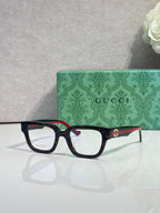 Gucci glasses, black frame with red-green temples, clear lenses