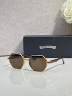 Chrome sunglasses with dark octagonal lenses and gold metal frame with white side arms