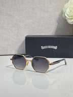 Chrome sunglasses with dark octagonal lenses and gold metal frame with white side arms