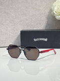 Chrome sunglasses with dark octagonal lenses, black frame, and red side arms