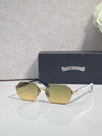 Hexagon sunglasses with yellow-gold lenses and gold metal frame, white temple tips