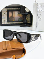 Celine sunglasses with dark frames, gold logo on temple, dark lenses