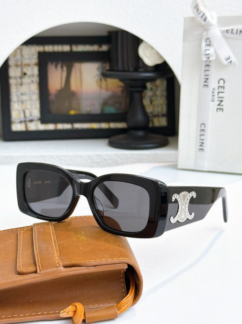 Celine sunglasses with dark frames, gold logo on temple, dark lenses