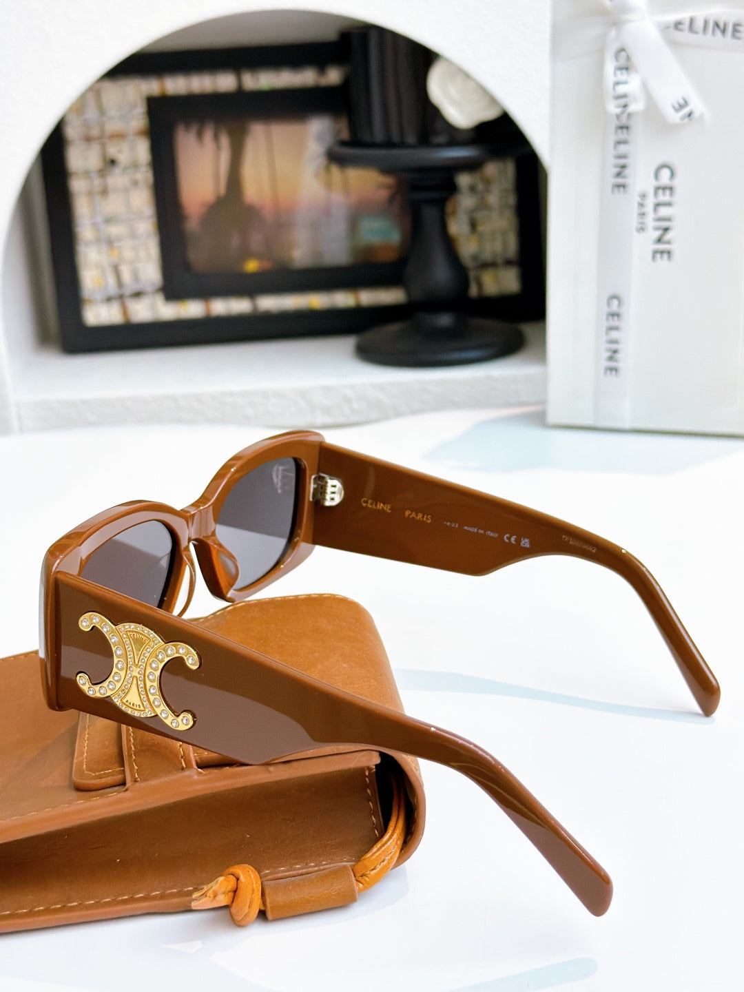 Celine sunglasses with brown frames, gold logo on temple, tinted lenses