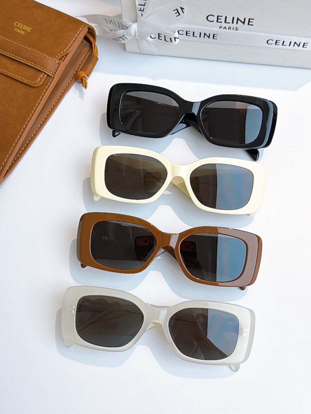 Celine sunglasses lineup with black, cream, brown, and white frames, tinted lenses