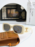 Celine sunglasses with cream frames and gold logo on temple, dark lenses