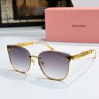 MiuMiu sunglasses with gold frames and purple tinted lenses, cat-eye style