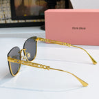 MiuMiu sunglasses with gold frames and dark lenses, side view with temple details