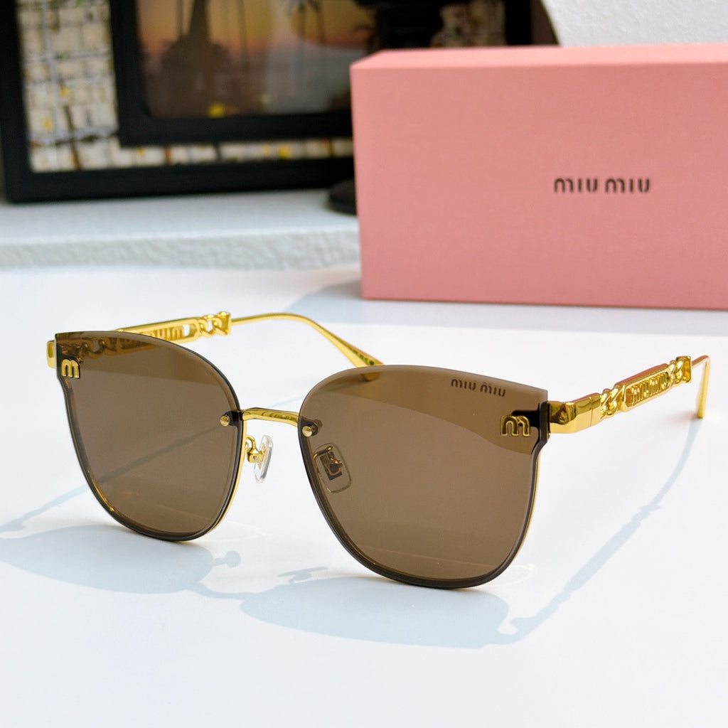 MiuMiu sunglasses with gold frames and brown tinted lenses, cat-eye style