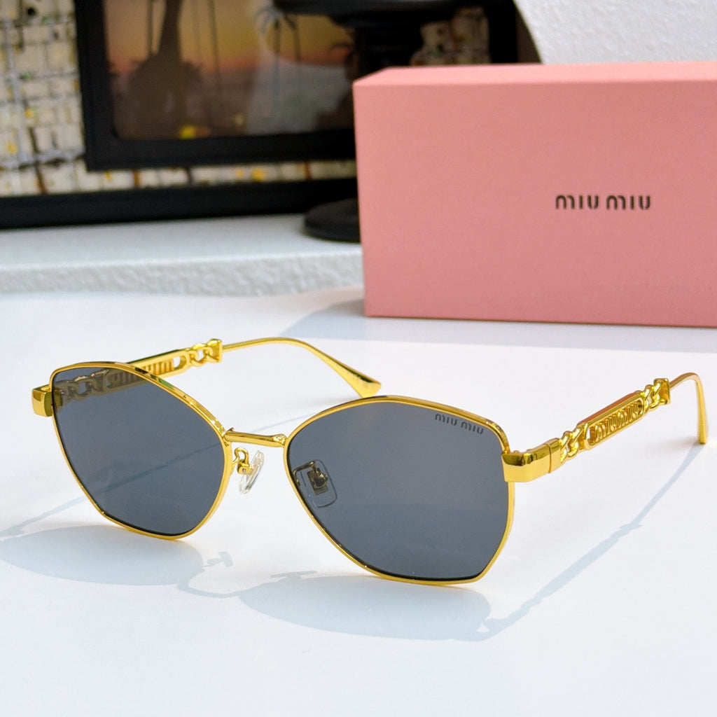MiuMiu glasses with gold-tone cat-eye frames and dark blue tinted lenses