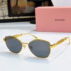 MiuMiu glasses with gold-tone cat-eye frames and dark blue tinted lenses