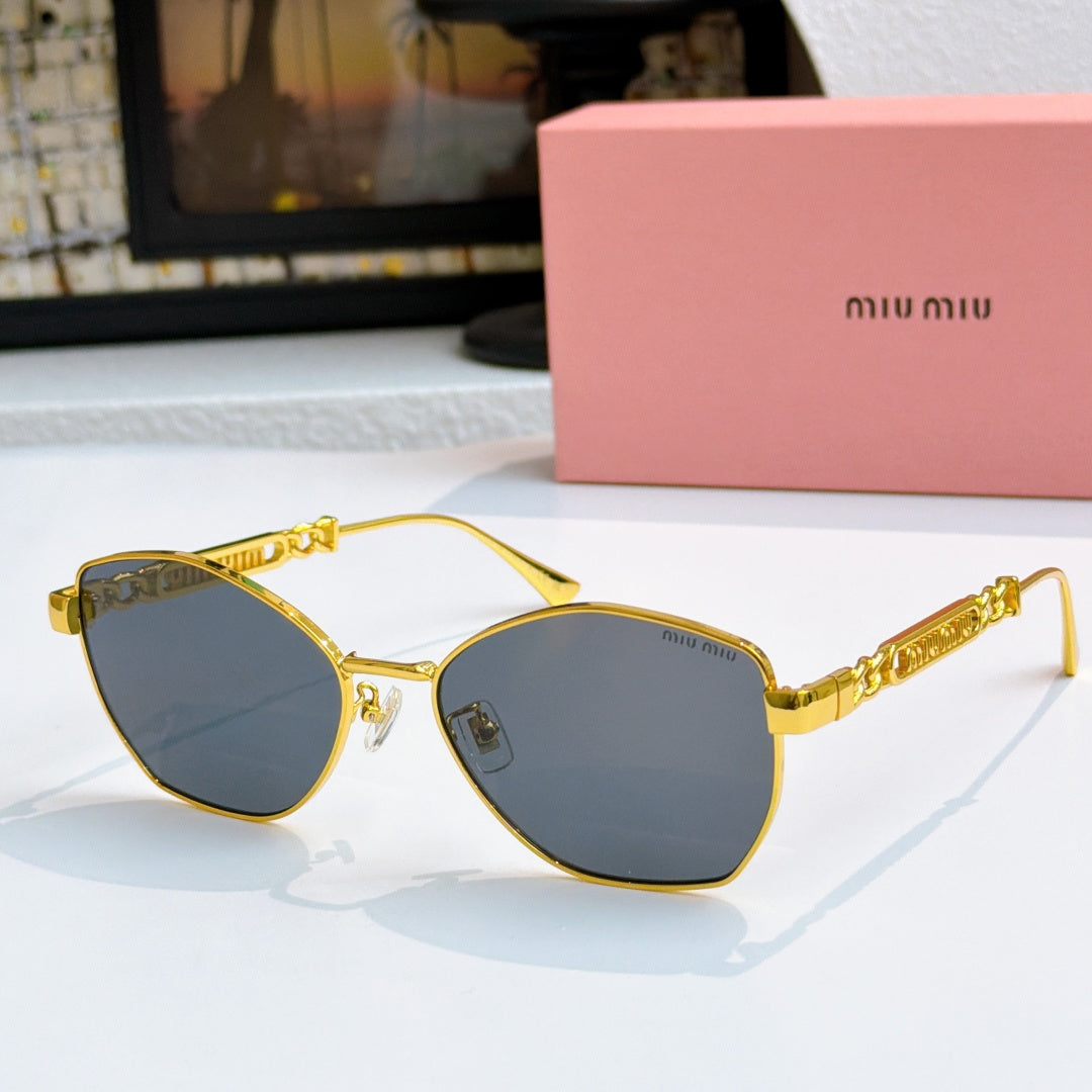 MiuMiu glasses with gold-tone cat-eye frames and dark blue tinted lenses