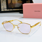 MiuMiu glasses with gold-tone cat-eye frames and tinted lenses