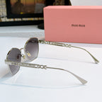 MiuMiu glasses with silver-tone cat-eye frames and chain-detail temples