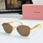 MiuMiu glasses with gold-tone cat-eye frames and dark brown tinted lenses