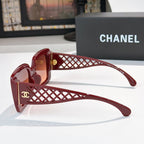 Red sunglasses side view with lattice temple and gold CC logo, tinted lenses