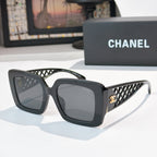 Square sunglasses with dark gray frame and gray-tinted lenses, lattice temple detailing