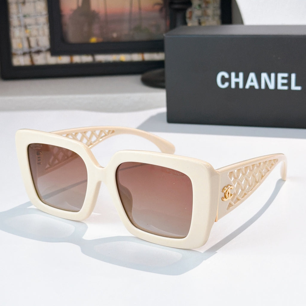 Square sunglasses with cream frame and rose-tinted lenses, lattice temple details