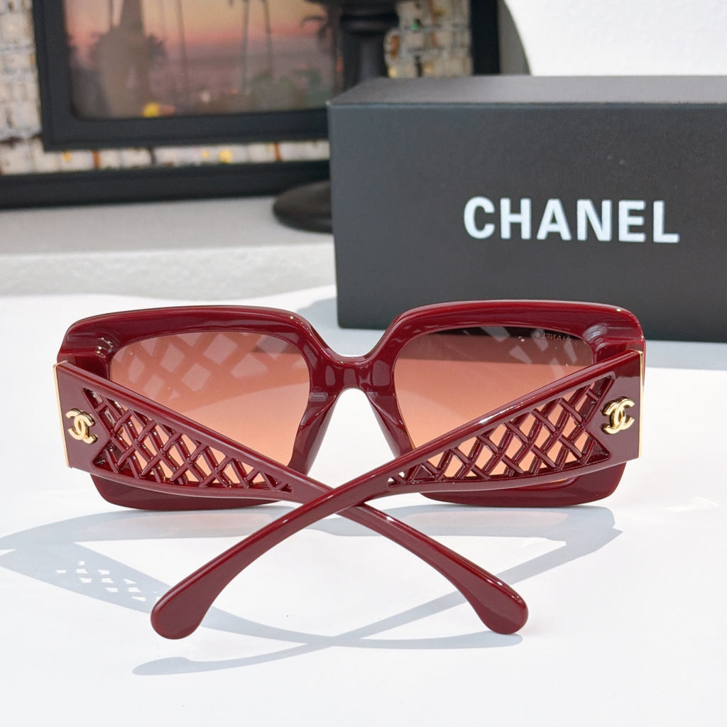 Red square sunglasses front view with lattice temple and gold CC logo, tinted lenses