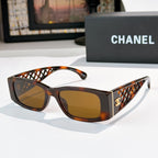Tortoiseshell sunglasses with diamond-pattern temples and gold Chanel logo