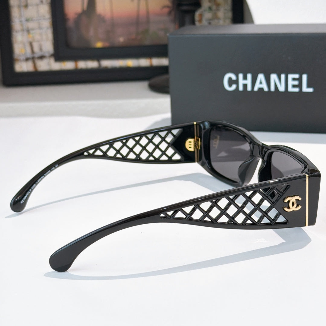 Black sunglasses with diamond-pattern temples and gold Chanel logo