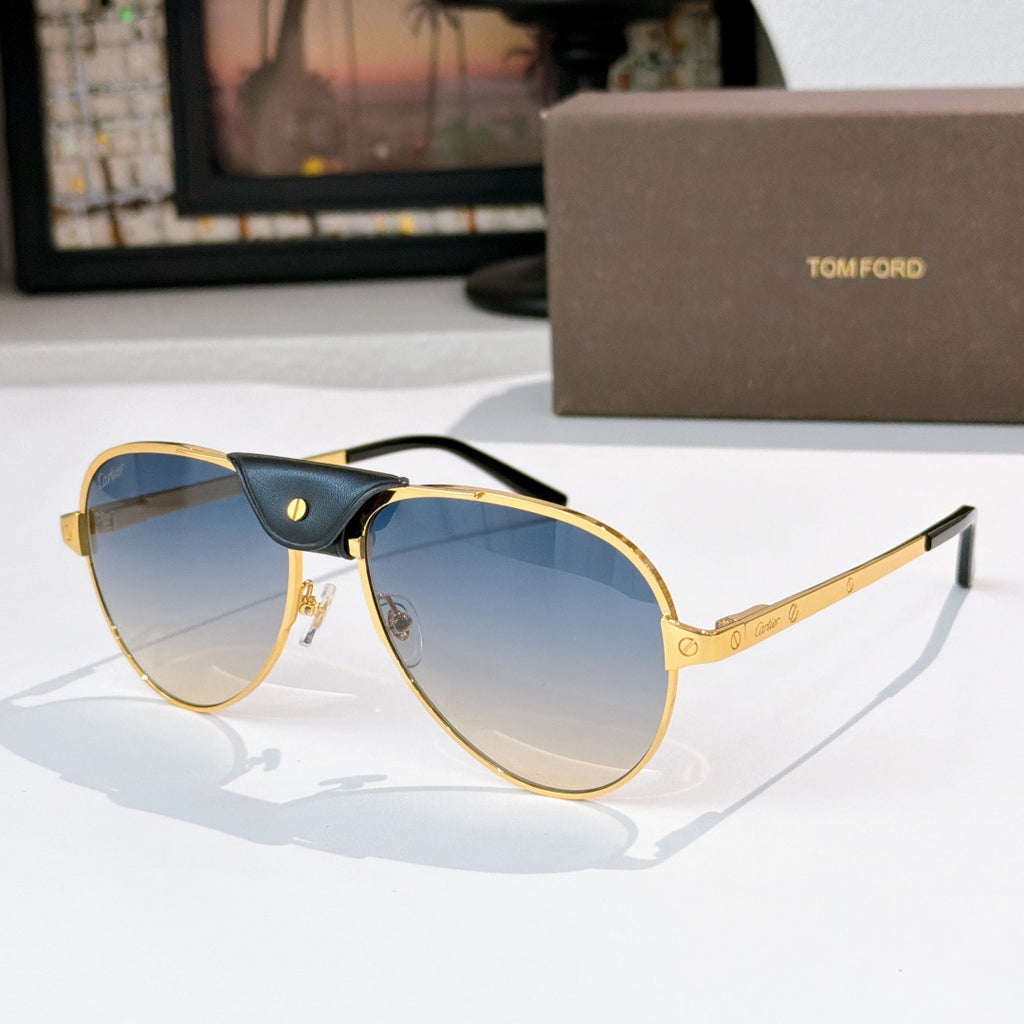 Gold-framed aviator sunglasses with blue lenses and black center bridge