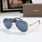 Silver-gray framed aviator sunglasses with blue tinted lenses and black temple arms