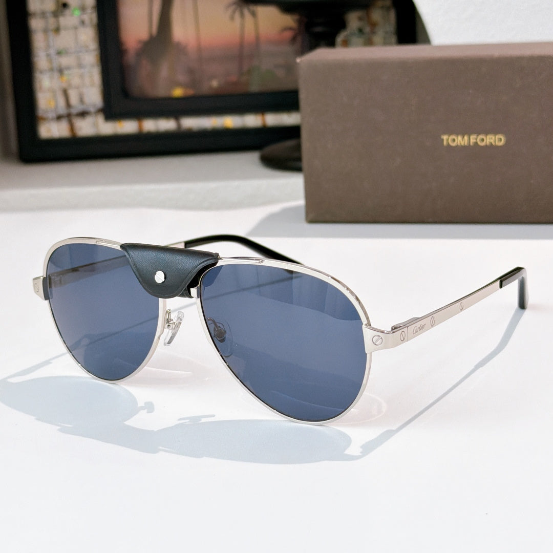 Silver-gray framed aviator sunglasses with blue tinted lenses and black temple arms