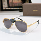 Gold-framed aviator sunglasses with dark gray lenses and black temple arms