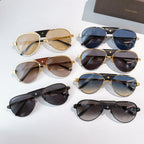 Assorted aviator sunglasses with gold and dark frames, featuring tinted lenses