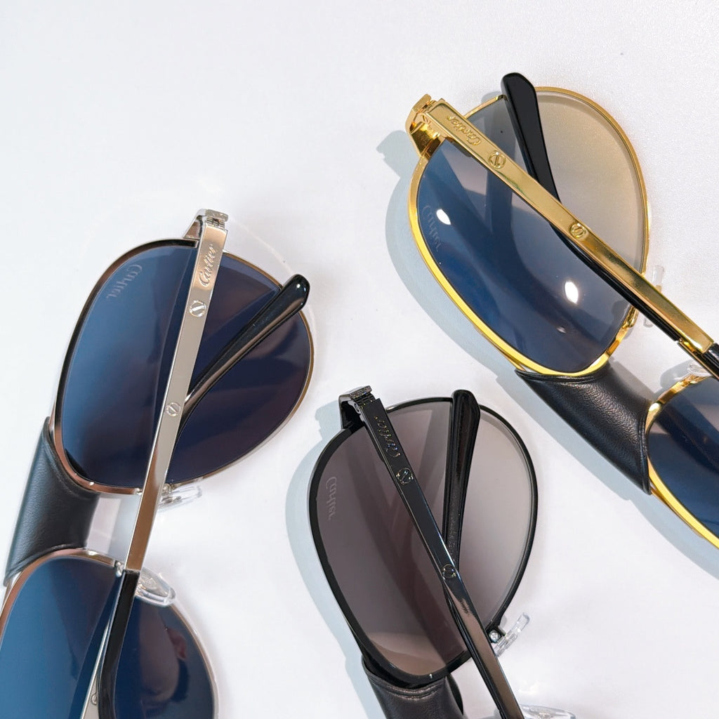 Assorted aviator sunglasses with gold, silver, and black frames and tinted lenses