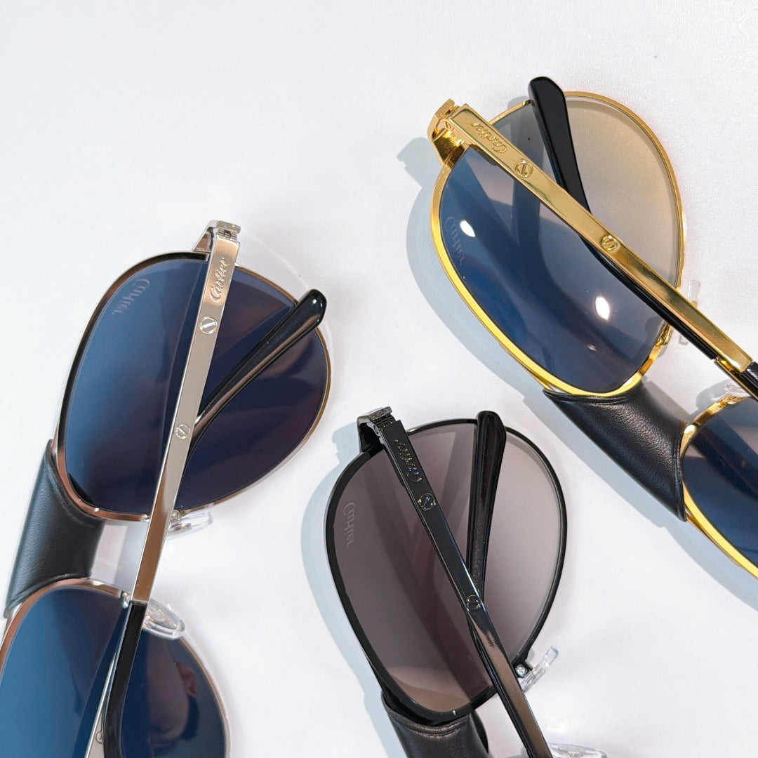Assorted aviator sunglasses with gold, silver, and black frames and tinted lenses