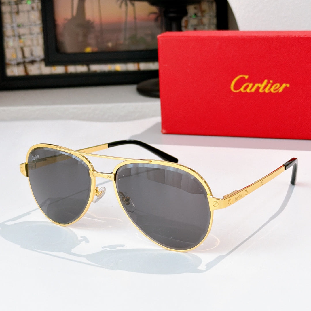 Cartier sunglasses with dark lenses and gold frame, black tips on metal temples
