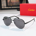 Cartier sunglasses with dark round lenses and black frame, metal temples