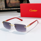 Cartier sunglasses with red temples and dark blue-tinted lenses, gold accents
