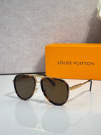 Louis Vuitton sunglasses with brown tinted lenses and gold-tone metal frame