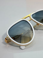Louis Vuitton sunglasses with white frames and blue mirrored lenses