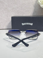 Chrome sunglasses with dark gradient lenses, blue patterned temples, and chrome hardware