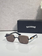 Chrome sunglasses with brown gradient lenses, dark frame, and metal temple accents