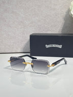 Chrome sunglasses with smoke gradient lenses, gold-tone frame, and decorative metal detail