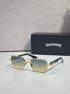 Chrome sunglasses with light gold gradient lenses, gold-tone frame, and blue patterned arms