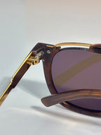 Louis Vuitton sunglasses with tortoiseshell frame and gold-toned temple detail