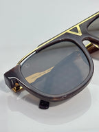 Louis Vuitton sunglasses with dark tortoiseshell frame and gold-toned temple hinge