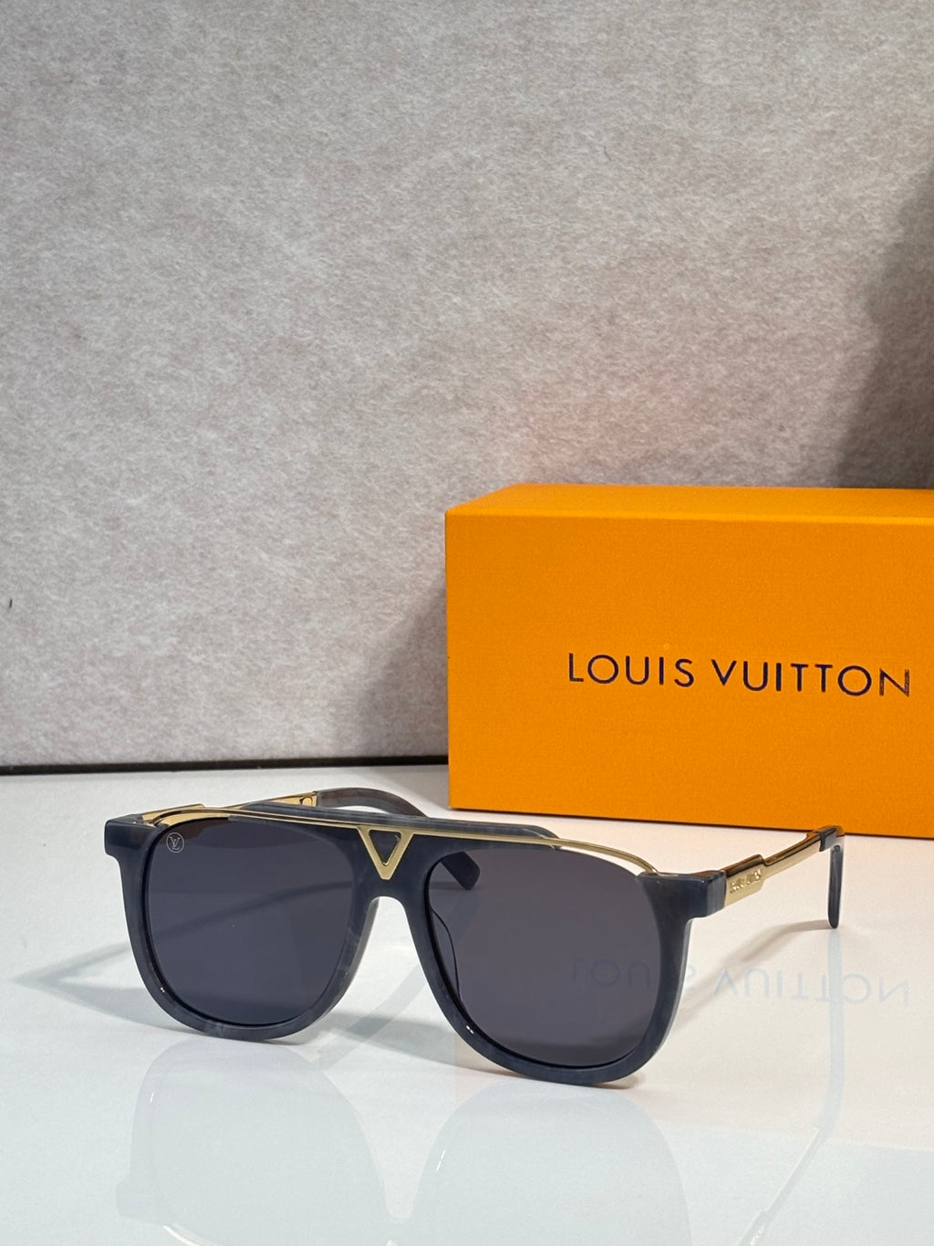 Louis Vuitton square sunglasses with dark smoke lenses and tortoiseshell frame