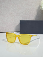 Sunglasses with yellow frame and yellow tinted lenses.